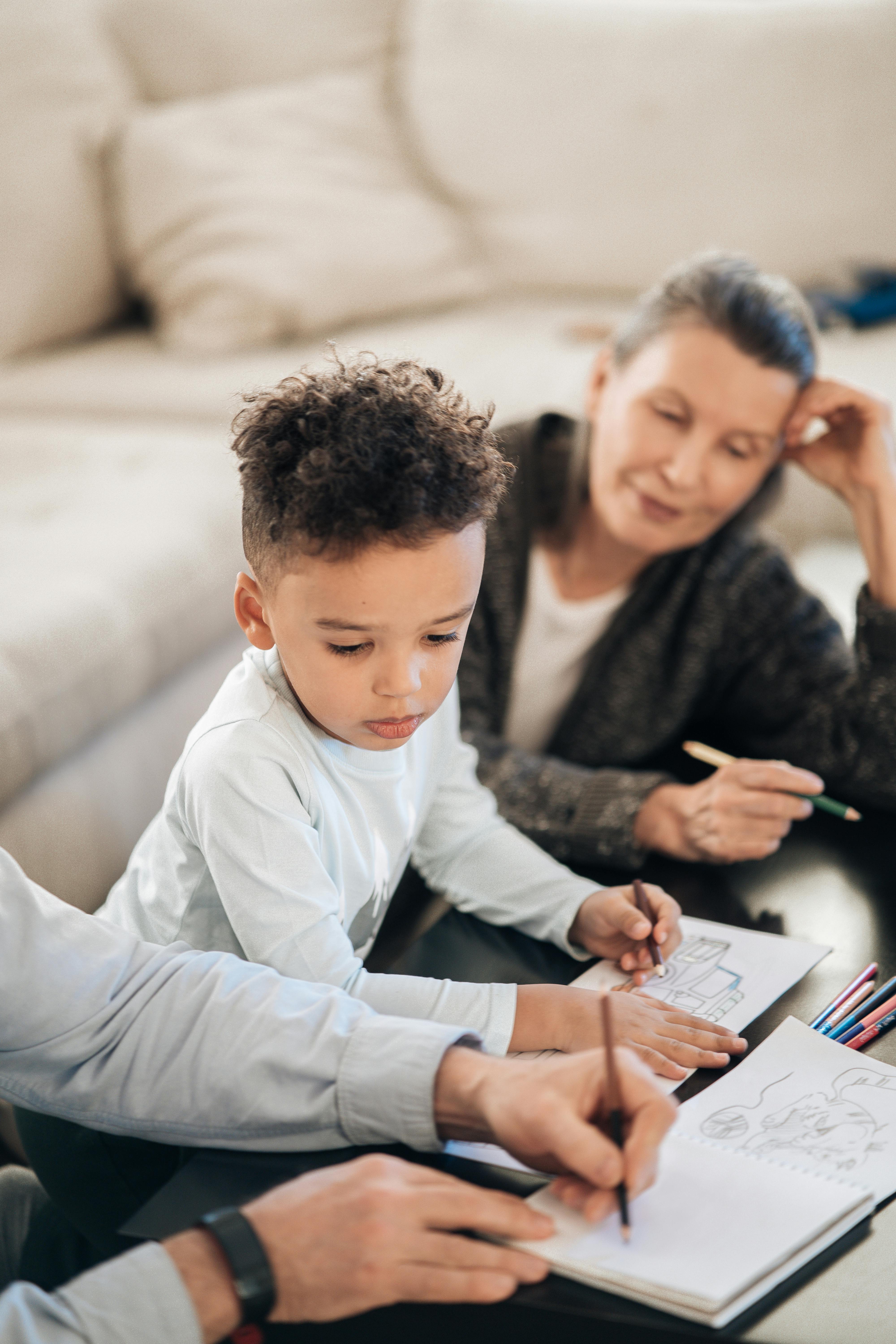 Parent and young child working together on a hands-on learning activity